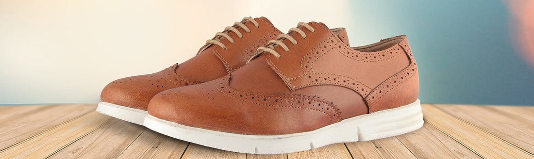 Tan genuine leather wingtip brogue shoes perforated medallion detail white sneaker sole front view – TZARO