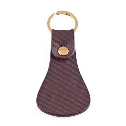 Brown textured leather keychain gold ring attachment close-up – TZARO